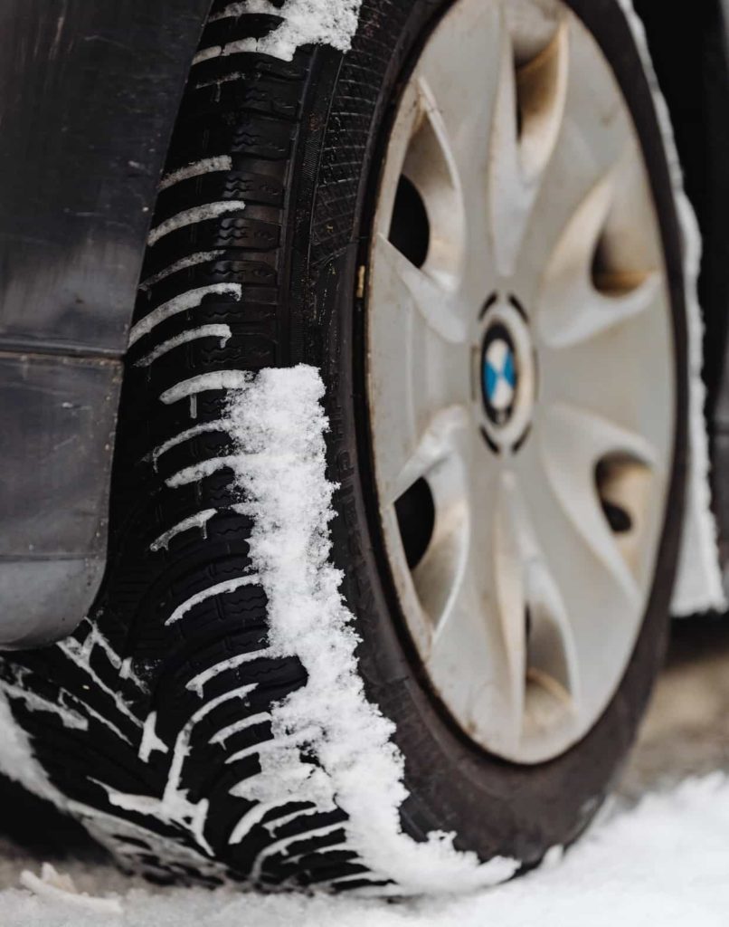 TIRE WITH SNOW IN TREADS