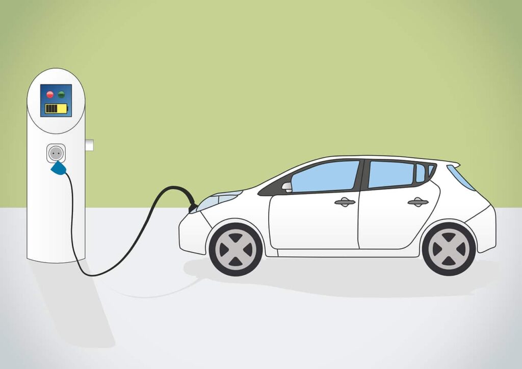 ELECTRIC CAR PLUGGED INTO CHARGING STATION