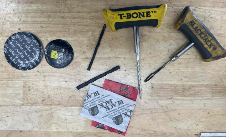TIRE PLUGS AND TIRE PATCHES ON WORK BENCH