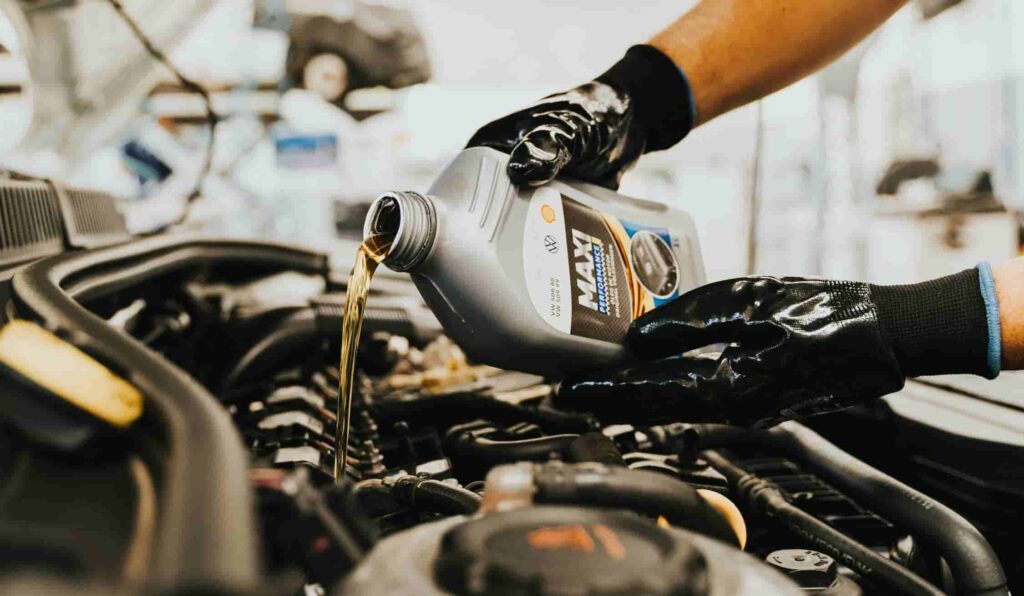 ADDING ENGINE OIL TO ENGINE